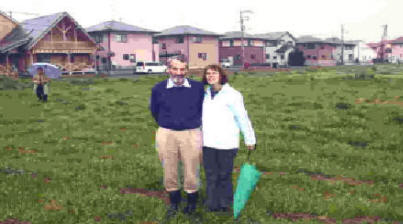 Jim and Darla Snipe stand on the land they are claiming for their work in Japan  
