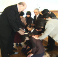 Tony Abram with Japanese ministers ordaining 